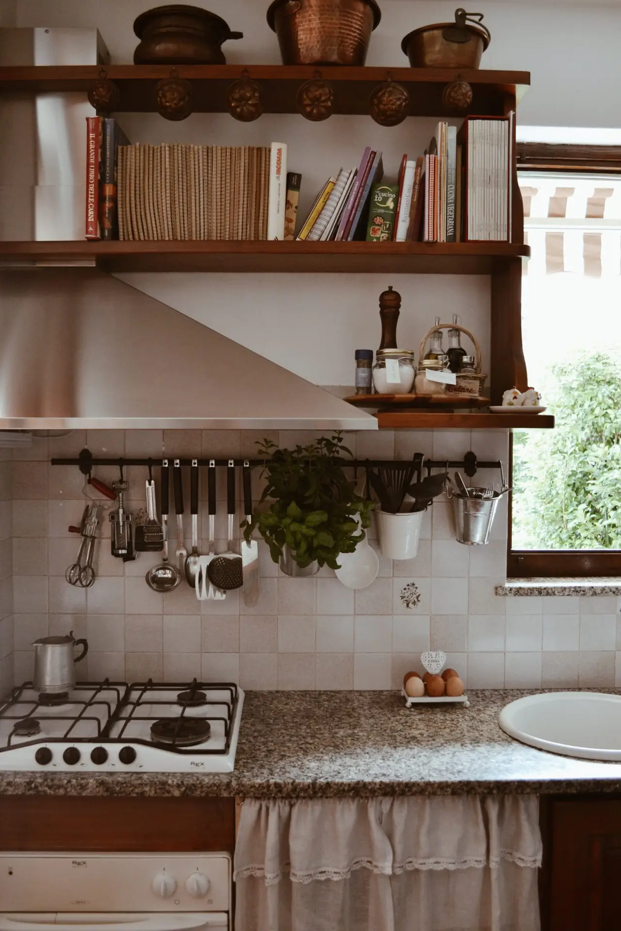 Vintage kitchen with books, utensils and herbs — the lived-in soul of Casa Mafalda